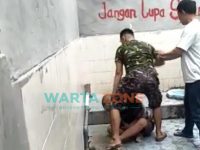 Caption: Tangkap layar video penganiayaan yang diduga terjadi luar ruangan (kamar mandi) Lapas Kelas 2A Jember.