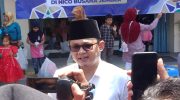 Foto: Ketua Asosiasi Pemerintah Desa Seluruh Indonesia (APDESI) Jember yang juga Kepala Desa Sidomulyo, Kamiludin, saat diwawancarai media.